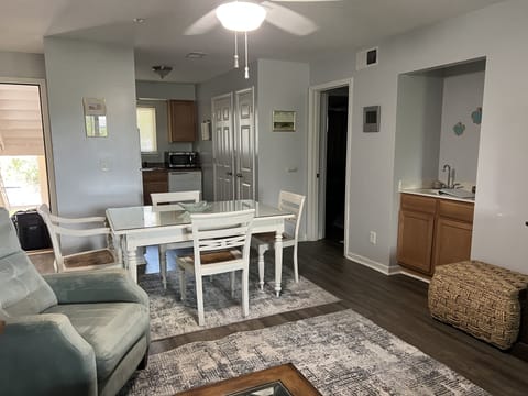 Living room to kitchen view; dining table