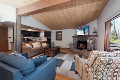 Main Living Space and Kitchen - Wood burning fireplace (firewood provided), TV, Views and Deck access