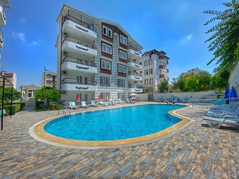 Seasonal outdoor pool, pool umbrellas, sun loungers