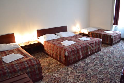 Quadruple Room | Desk, blackout drapes, iron/ironing board, free WiFi