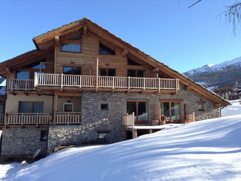 Left hand ground floor apartment and balcony on the snow 