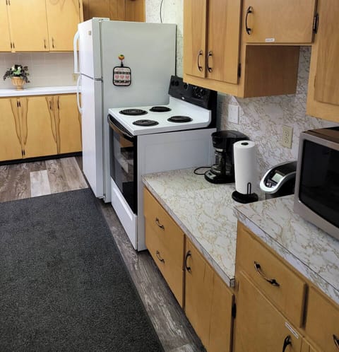 There is another frig in storage behind the kitchen and a 3rd upstairs.