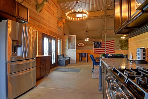 Kitchen has all the pots and pans, silverware, plates, bowls, sm. appliances