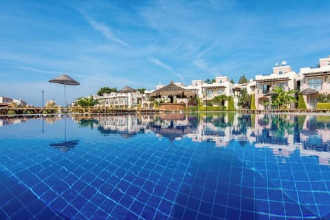 7 outdoor pools, open 9:00 AM to 7:00 PM, pool umbrellas, sun loungers