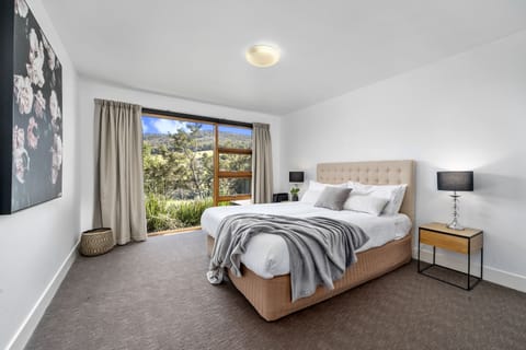 Bedroom 2 has a Queen bed and views along the river valley