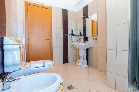 Shower, free toiletries, hair dryer, slippers