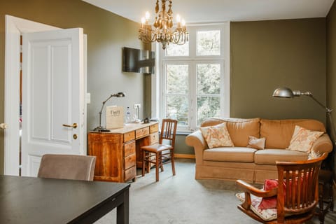 Suite, Park View, Garden Area | Living area | Flat-screen TV