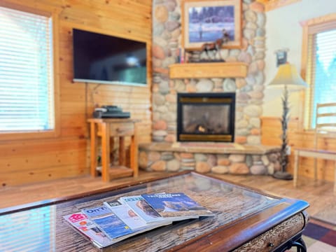 Natural light pours in through large windows, tying it all together with a view of the forest just beyond.