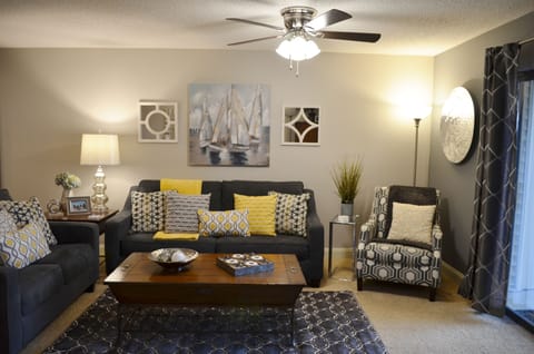 Great Room with sleeper sofa, loveseat, chair and 55" smart TV.