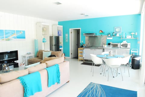 Newer photo Living room reverse angle at efficiency kitchen