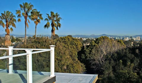 view from roof top deck facing the city and mountains.