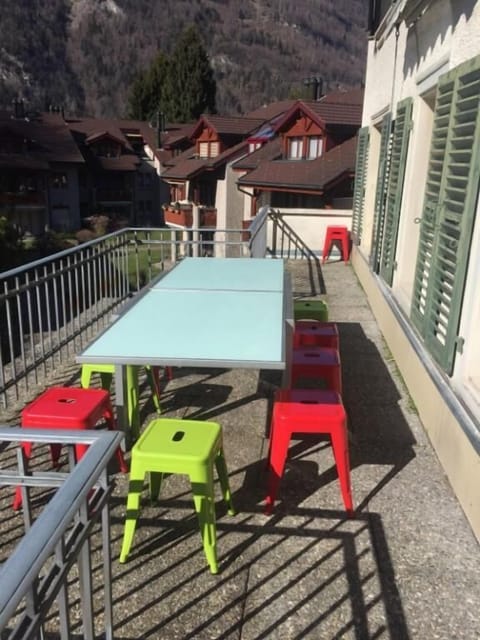 Balcony with seating for 12 and wind out shade cover.