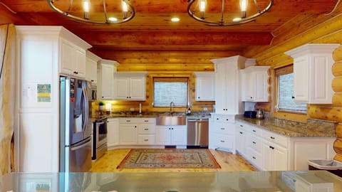 Beautiful full size kitchen that includes basic appliances, spices, pots and pans.