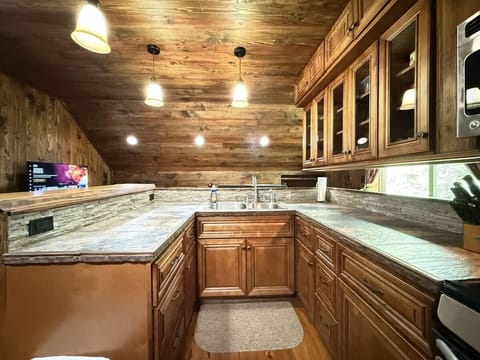 In the kitchen there is cabinets with kitchen appliances, dishes, and basic necessities you need to cook during your stay.