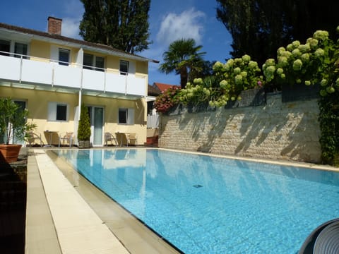 Seasonal outdoor pool, open 8:00 AM to 8:00 PM, sun loungers