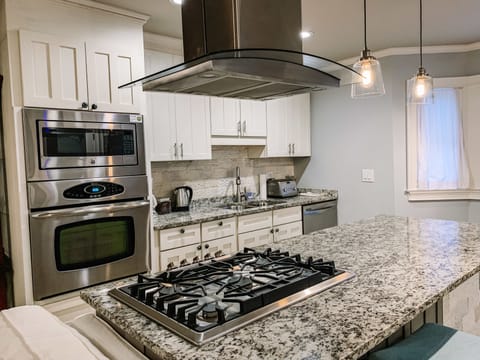 Microwave, coffee/tea maker, cookware/dishes/utensils, paper towels