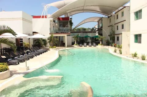 Outdoor pool, open 9 AM to 10 PM, free cabanas, pool umbrellas