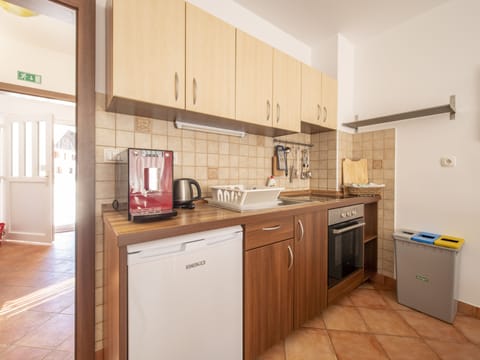 Duplex Three-Bedroom Apartment (5-10 adults) | Private kitchen | Fridge, coffee/tea maker, electric kettle, dining tables
