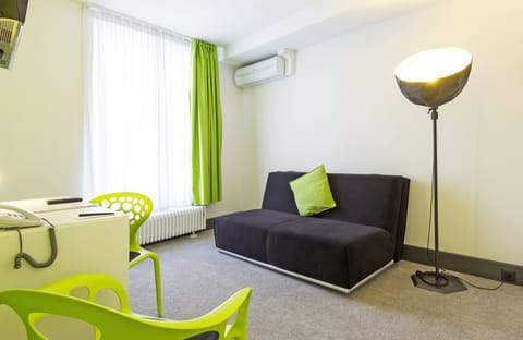 Family Suite | Living area | Flat-screen TV