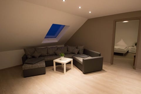 Apartment, 3 Bedrooms | Living area | Flat-screen TV