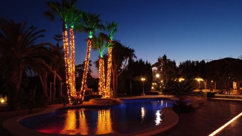 Outdoor pool, open 9:00 AM to 10:00 PM, sun loungers