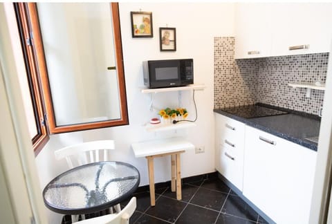 Triple Room, Kitchenette | In-room safe, soundproofing, free WiFi, bed sheets