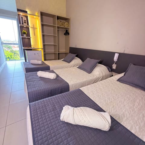 Triple Room | Minibar, desk, iron/ironing board, free WiFi
