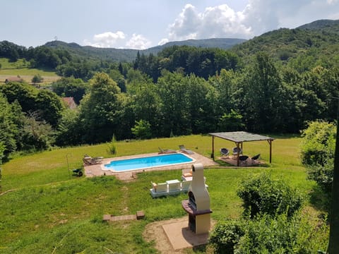 Overlooking the garden, pool, BBQ and surrounding private land. 