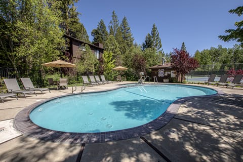 Saint Francis HOA Pool - Relax by the outdoor pool surrounded by trees & lounge chairs