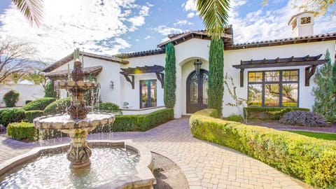 Front entrance features a beautiful water feature & manicured landscaping