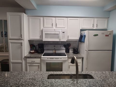 Kitchen, pantry cabinet, stove, microwave, fridge, toaster, coffee maker 