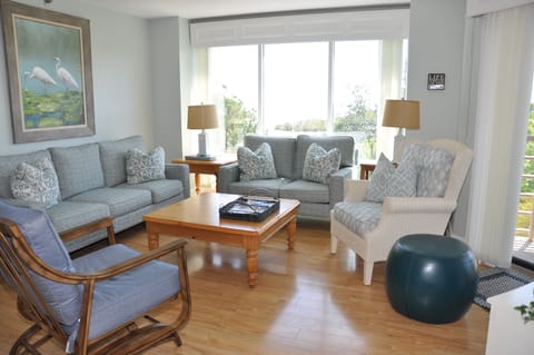 Living Room m with comfy couches and chairs and Ocean Views.  New Furniture 2024