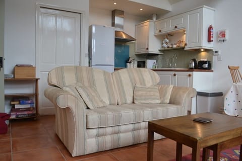 living area with kitchen behind