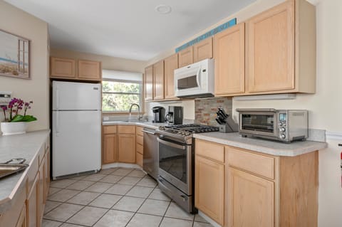 Kitchen is fully equipped with all appliances and cookware.