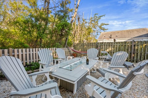 Fully fenced backyard with outdoor table and a FIRE TABLE for cooler nights!