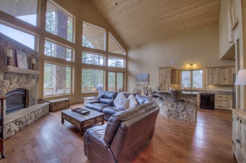 Inside view from the front door. Leather sectional perfect for stretching out.