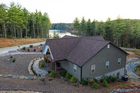 View as you pull up to home, stone stairway to front entrance and side entrances