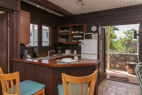 shutters and screen door open for light and air.