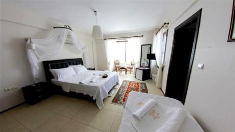 Family Quadruple Room | Free minibar, iron/ironing board, free cribs/infant beds, free WiFi