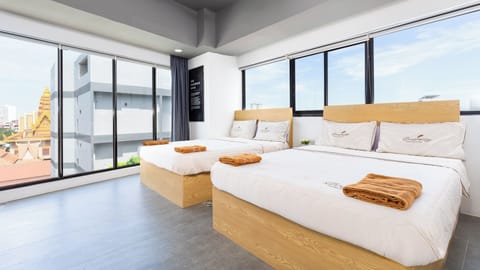 Deluxe Quadruple Room, 2 Double Beds, River View | In-room safe, individually furnished, desk, laptop workspace