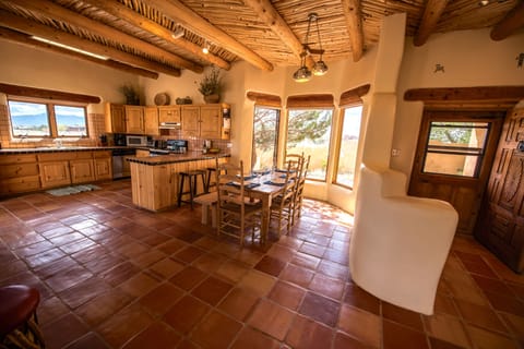 Foyer and dining area. Viga pole and latilla ceiling.