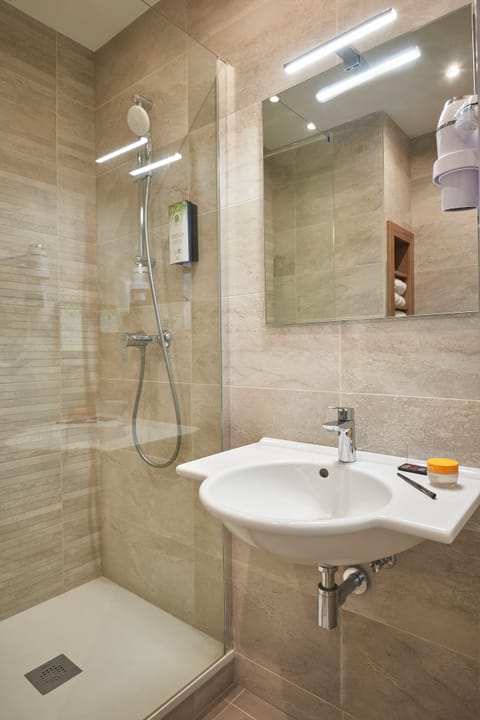 Shower, eco-friendly toiletries, hair dryer, towels