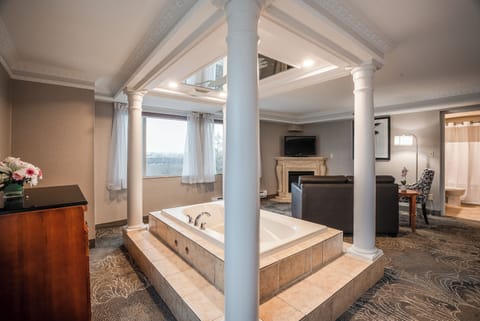 Luxury King Suite with Jetted Tub | Down comforters, in-room safe, desk, blackout drapes