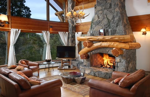 Deluxe Chalet, 5 Bedrooms, Mountain View | Living area | 55-inch LED TV with satellite channels, TV, fireplace
