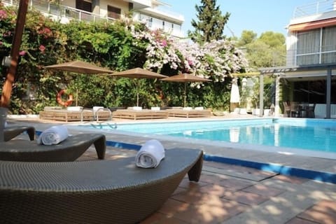 Seasonal outdoor pool, open 10:30 AM to 6 PM, sun loungers
