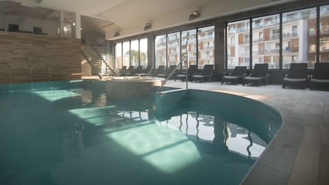 Indoor pool, seasonal outdoor pool, pool umbrellas, sun loungers