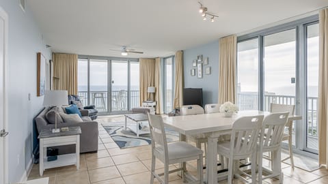 Bright, open-concept living and dining space designed for gathering and relaxing. 