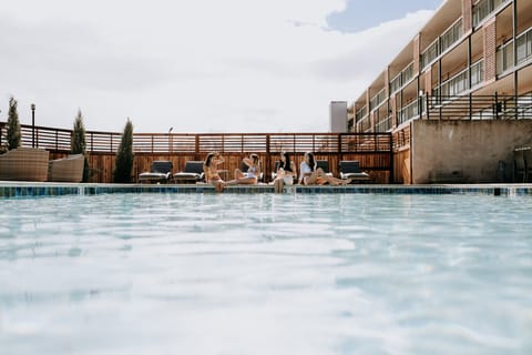 Seasonal outdoor pool, open 11:00 AM to 10:00 PM, sun loungers