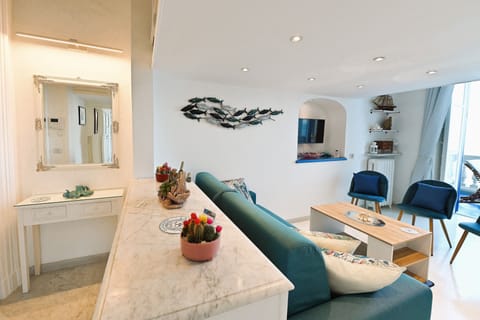 Deluxe Suite | Living area | Flat-screen TV