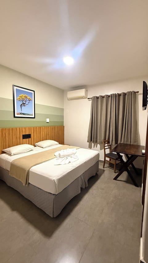 Deluxe Double Room | Minibar, desk, blackout drapes, iron/ironing board